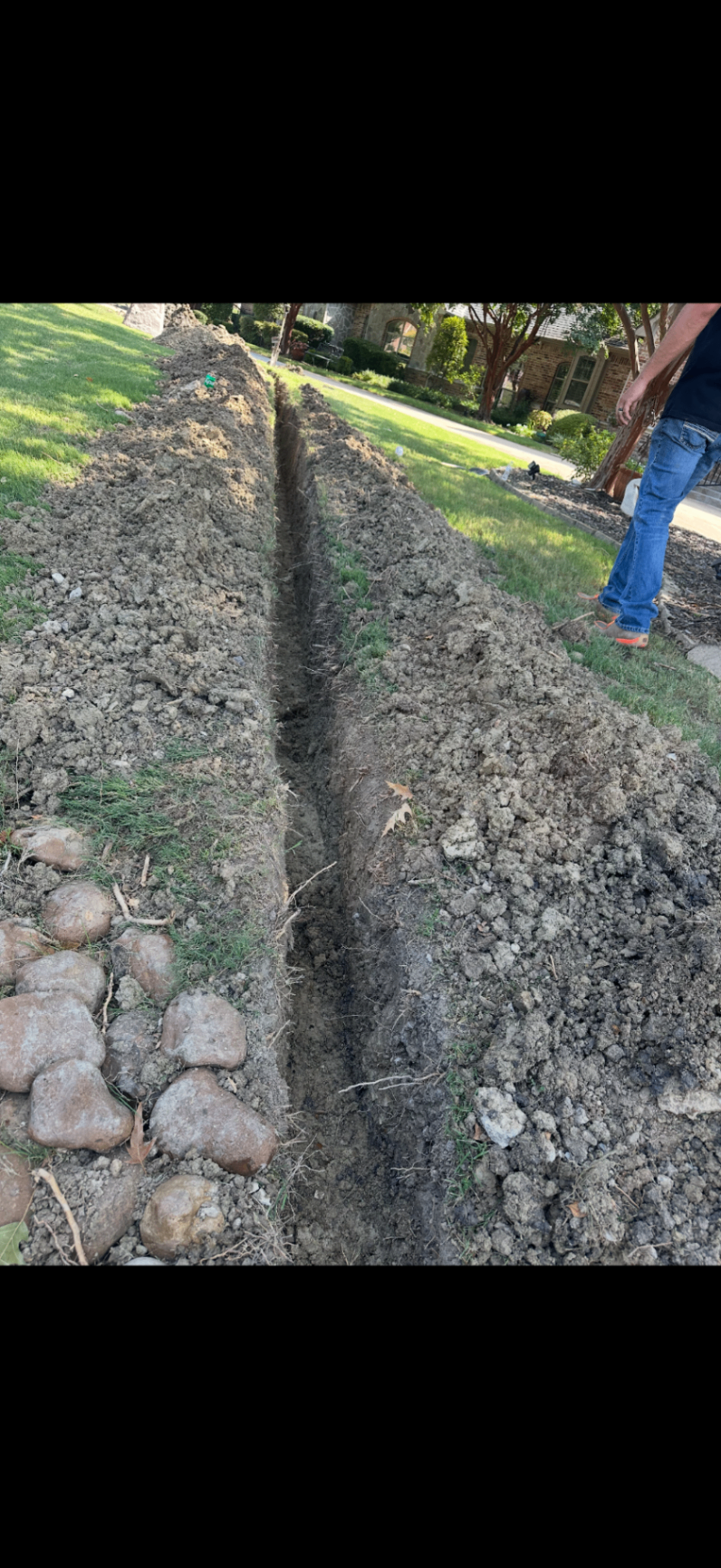 French drain trench dug along front yard